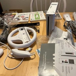 Nintendo Wii with Mario Kart, 2 remotes, and additional accessories/games
